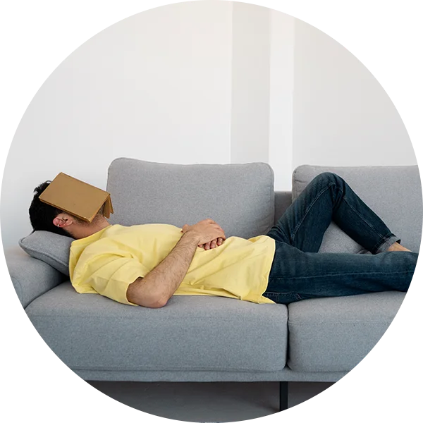 Person lying on a couch to signify generalized weakness caused by high blood sugar.