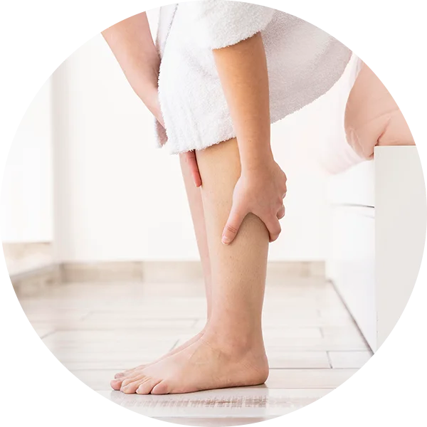 Person touching leg to depict numbness or tingling caused by sciatic nerve irritation.